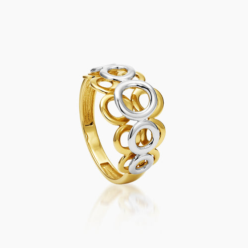 6 - TWO-TONE DECORATIVE CIRCLES LADIES RING IN (SAUDI) 18K YELLOW AND WHITE GOLD