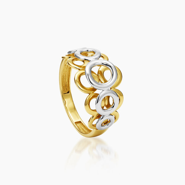6 - TWO-TONE DECORATIVE CIRCLES LADIES RING IN (SAUDI) 18K YELLOW AND WHITE GOLD