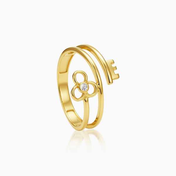 6 - KEY AND FLOWER WITH ZIRCONIAN STONE LADIES RING IN (SAUDI) 18K YELLOW GOLD