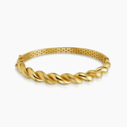 POLISHED AND TEXTURED TWIST BANGLE BRACELET IN (SAUDI) 18K YELLOW GOLD