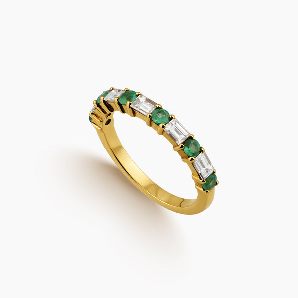 6.75 = EMERALD AND BAGUETTE DIAMONDS ETERNITY LADIES RING IN 18 YELLOW GOLD