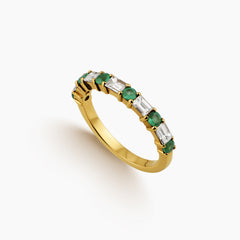 6.75 = EMERALD AND BAGUETTE DIAMONDS ETERNITY LADIES RING IN 18 YELLOW GOLD