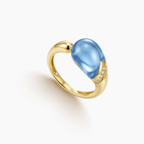 6.5 - BLUE TOPAZ LADIES RING WITH DIAMOND ACCENTS IN 18K YELLOW GOLD