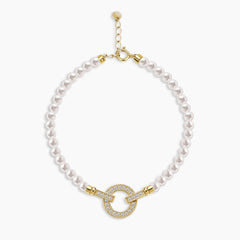 PEARL BRACELET WITH CIRCLE CHARM AND PAVE SET GEMS IN 18K YELLOW GOLD