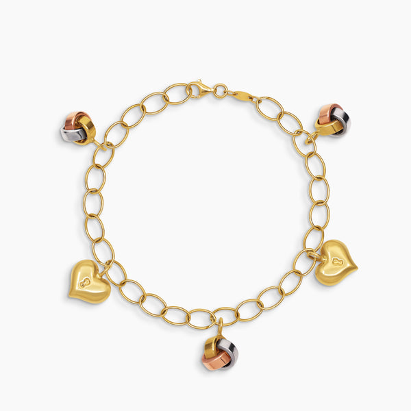 OVAL LINK BRACELET WITH PUFF HEART LOCK AND TRI-COLOR LOVE KNOT CHARMS IN (SAUDI) 18K YELLOW, WHITE AND ROSE GOLD